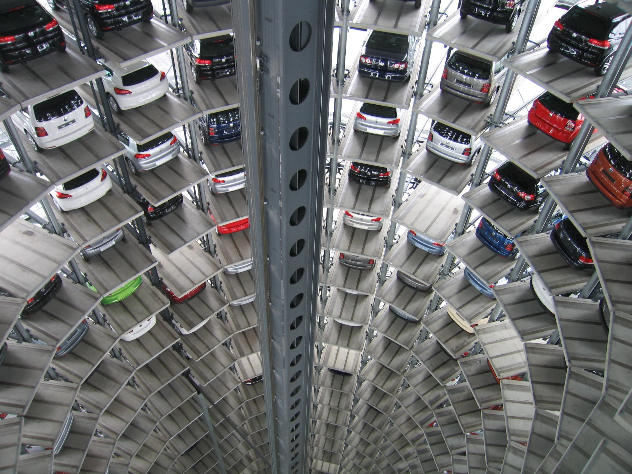 Circular parking garage with a lift in the middle that can elevate the cars into the spots